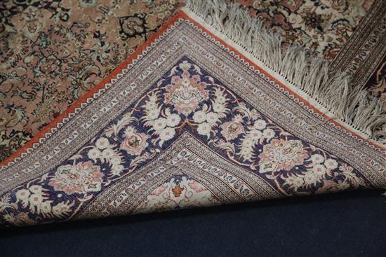 A Chinese silk pink ground rug, 6ft by 4ft.